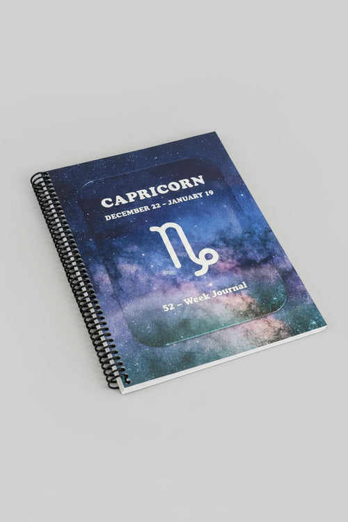 Capricorn 52-Week Zodiac Journal with grey studio light background