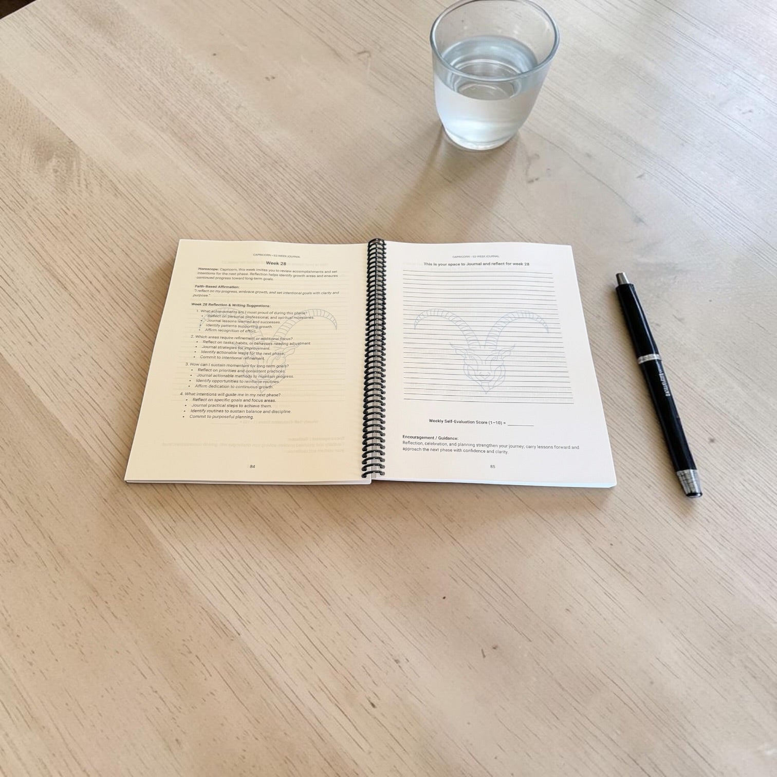 Capricorn 52-Week Zodiac Journal opened in a lay-flat spiral-bound image