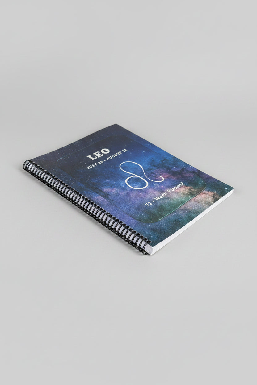 Leo 52-Week Zodiac Spiral-Bound Journal with a grey studio background